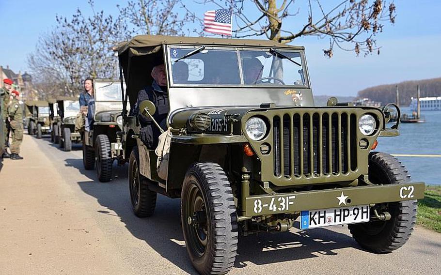 A parade of World War II vehicles brought the distinguished visitors to the site of the dedication ceremony for the Rhine River crossing monument in Nierstein, Germany, Saturday, March 25, 2017.