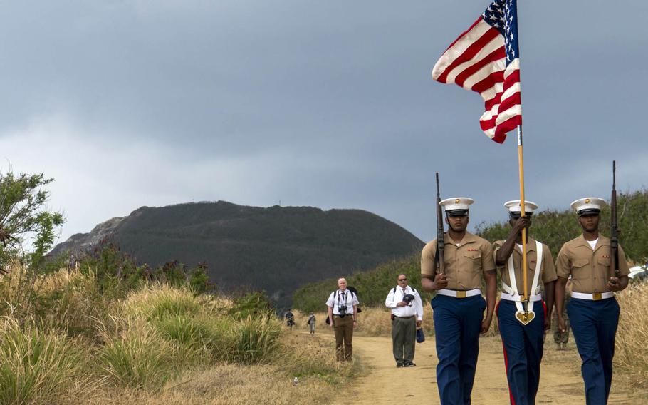 Marines from the III Marine Expeditionary Force on Okinawa take part in a ceremony marking the 72nd anniversary of the Battle of Iwo Jima, Saturday, March 25, 2017.