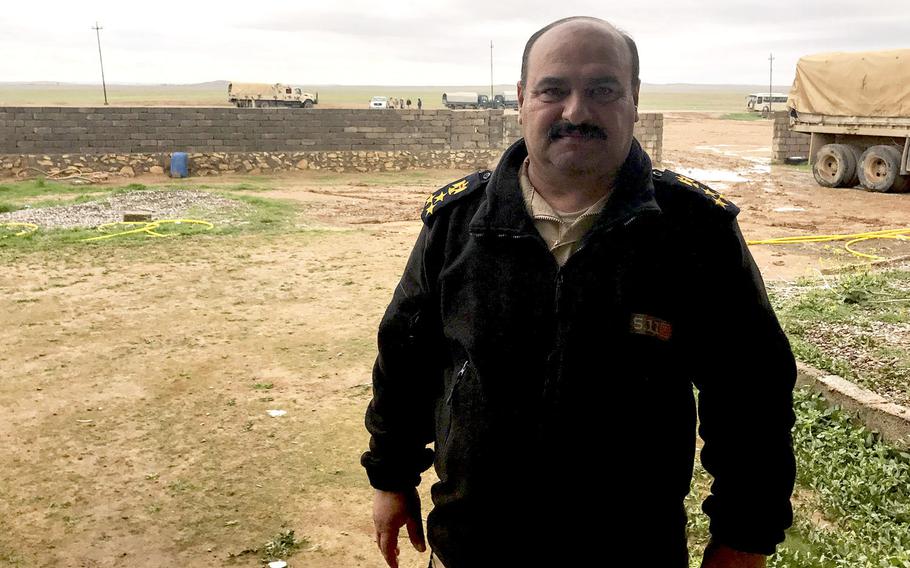 Brig. Gen. Ahmed Shaker, chief of staff of Iraq's 9th Armored Division, is pictured here on a muddy Iraqi base south of Mosul, near one built by U.S. forces advising the Iraqis and supporting them with intelligence and precision strike capabilities.