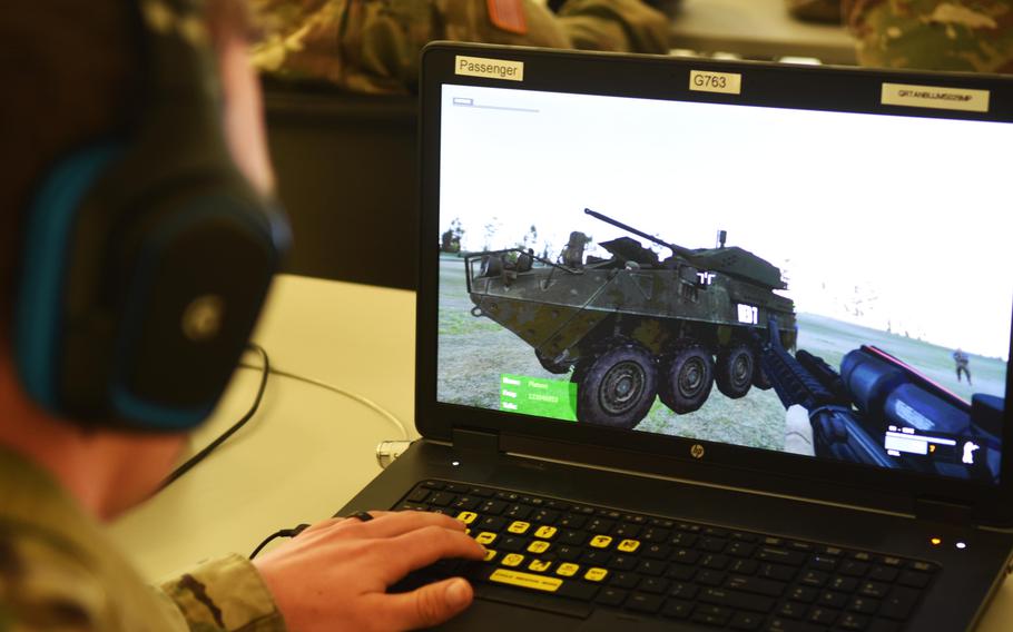 A soldier with the Army's 2nd Cavalry Regiment virtually train with the upcoming Dragoon Stryker, equipped with a larger 30 mm cannon, at Grafenwoehr, Germany, Thursday, March 30, 2017.
