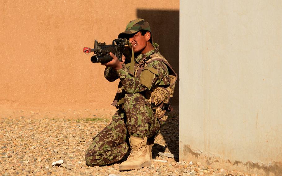 An Afghan National Army soldier mans his position while his fire team conducts a clearing drill at the Regional Military Training Center in Helmand province, Afghanistan, March 8, 2017. The soldiers are members of the ANA 215th Corps and will fight in one of Afghanistan's most contested provinces upon completion of their initial training.