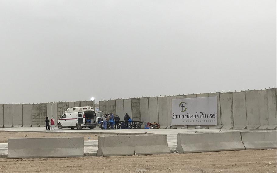 An ambulance brings the wounded to the Samaritan's Purse field hospital east of Mosul, Iraq, March 17, 2017. Officials say they've treated more than 900 people, many women in children, wounded in the offensive to retake the city from Islamic State fighters, who have held it since 2014.