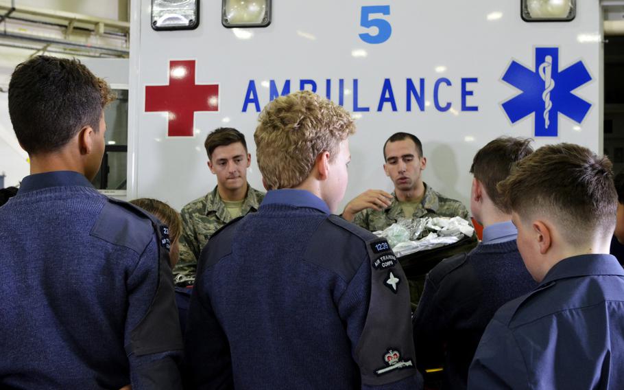 Royal Air Force Air Cadets watch a medical demonstration during a tour of U.S. Air Force operations and equipment at RAF Lakenheath, England, Friday, April 7, 2017.