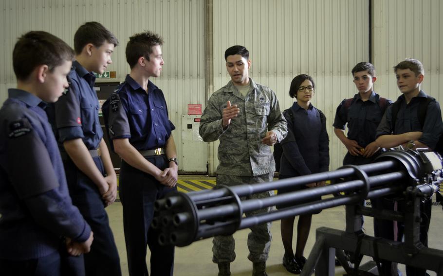 An airman answers questions from Royal Air Force Air Cadets about fighter jet weapon systems during a tour of U.S. Air Force operations and equipment at RAF Lakenheath, England, Friday, April 4, 2017.