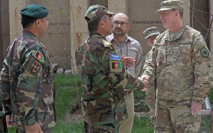 Incoming commander of 9th Air and Space Expeditionary Task Force-Afghanistan and NATO Air Command-Afghanistan Maj. Gen. James B. Hecker meets Afghan air force officials in Kabul shortly after assuming command on Tuesday, April 11, 2017.