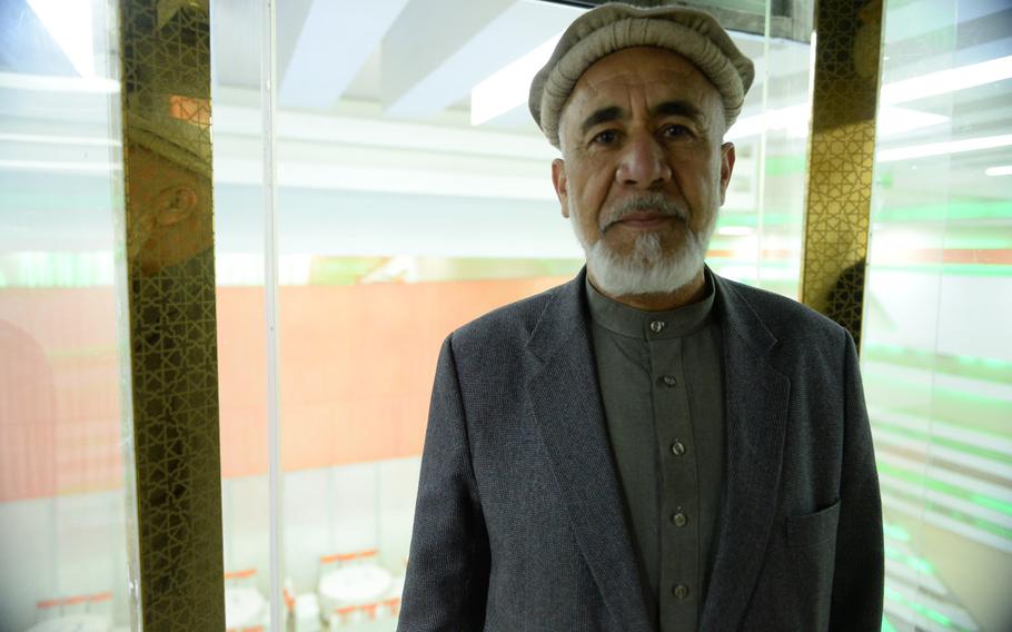 Alhaj Mohammad Shoaib Niazi, co-owner of Atlantis Wedding Hall in Kabul, Afghanistan, stands inside an elevator at the hall, April 5, 2017. Newlyweds descend in the elevator during their wedding ceremonies.