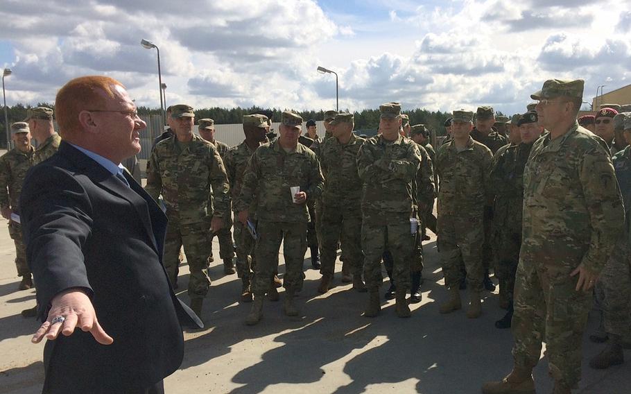 Robin Dothager, left, gives a tour of construction sites at Drawsko Pomorskie Training Area in Poland to USAREUR commander Lt. Gen. Ben Hodges, right, and other U.S. and allied leaders Wednesday, April 26, 2017. Poland has emerged as a new center of gravity for USAREUR, and dozens of facilities at several sites around the country are currently being built for storage, training and life support.