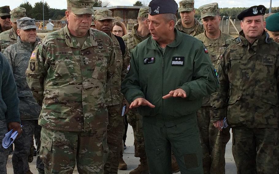 Lt. Gen. Ben Hodges, left, commander of U.S. Army Europe, confers with Polish Maj. Gen. Jan Sliwka during a visit to Drawsko Pomorskie Training Area, Poland, part of a four-day ''terrain walk'' of U.S. and allied leaders around strategic sites in central and Eastern Europe.