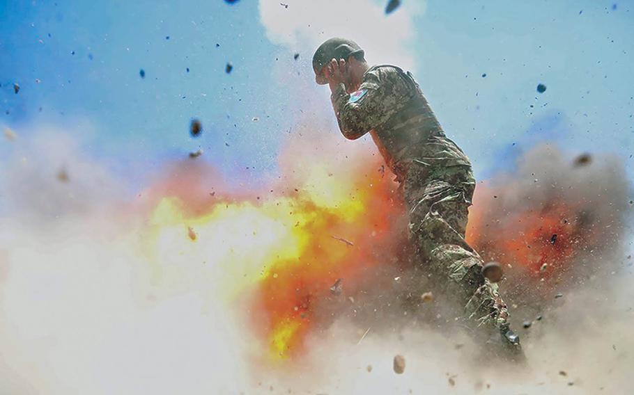 A mortar tube accidentally explodes during an Afghan National Army live-fire training exercise in Laghman province, Afghanistan, July 2, 2013. This photo was taken by U.S. Army Spc. Hilda Clayton, who died in the blast. 