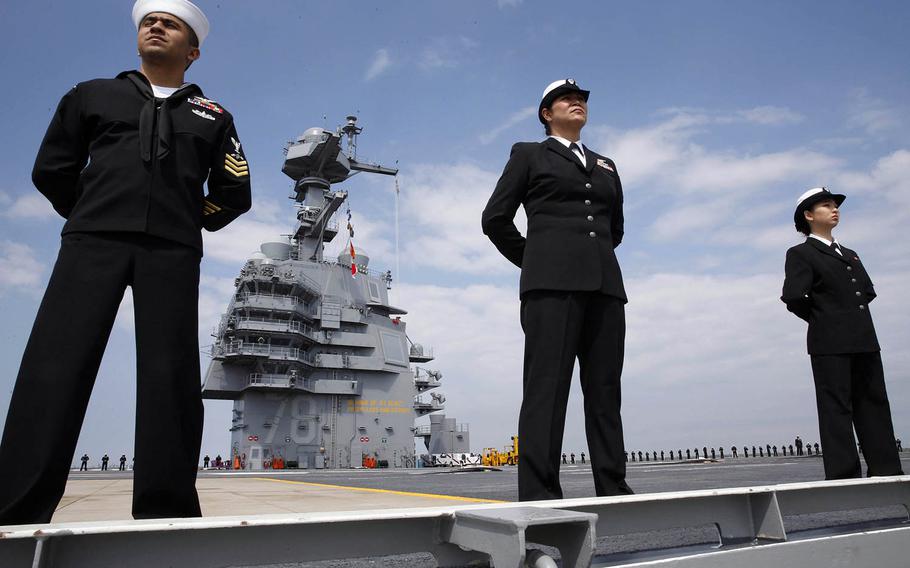 Sailors man the rails of the USS Gerald R. Ford as the aircraft carrier returns to Norfolk, Va., after conducting builder's sea trials, April 14, 2017.