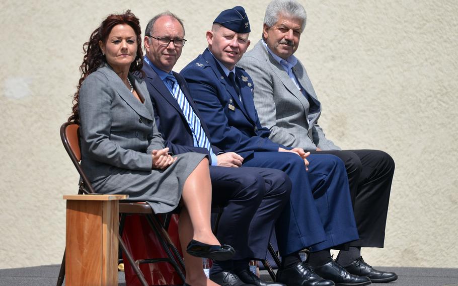 The speakers at the Bitburg High School closing ceremony listen to the school band play ''Pictures at an Exhibition,'' Thursday, June 8, 2017. From left are school principal Jennifer Remoy, Michael Ringelstein, the deputy mayor of Bitburg, Col. Joseph McFall, 52nd Fighter Wing commander, and Spangdahlem Mayor Klaus Rodens.