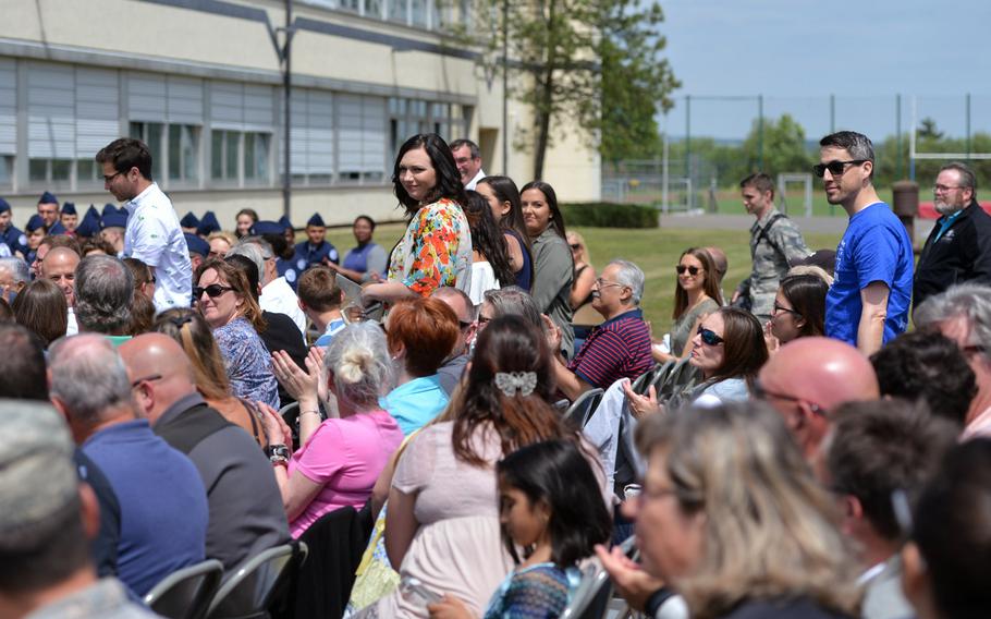 Returning Bitburg High School alumni stand while being recognized at the school's closing ceremony in Bitburg, Germany, Thursday, June 8, 2017.