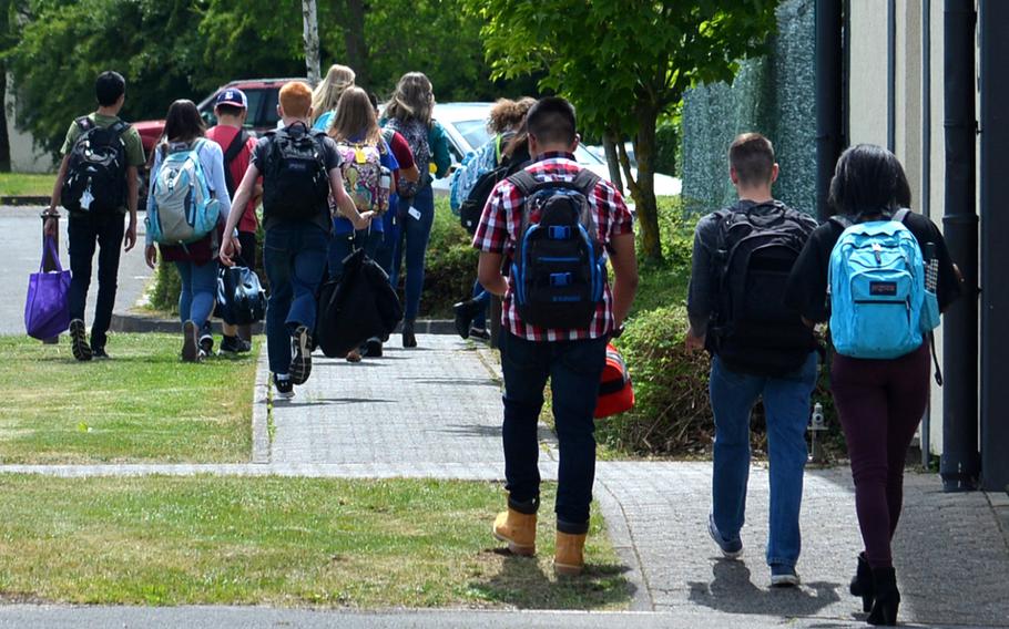 Bitburg High School students walk away from the school at the end of the day that saw a closing ceremony for the school, which is shutting its doors after 60 years of service, on Thursday, June 8, 2017.