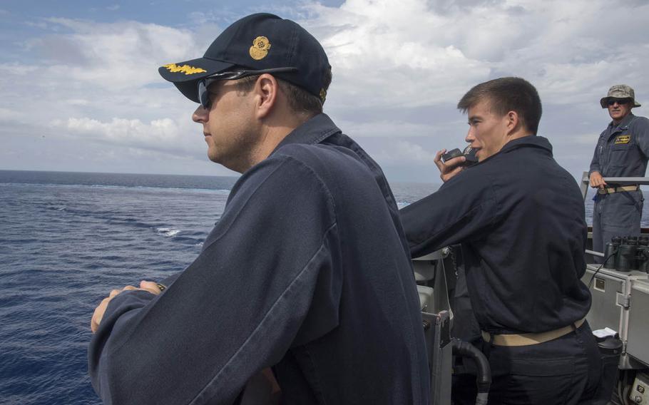 Sailors aboard the guided-missile destroyer USS Stethem take part in man-overboard training in the South China Sea, July 10, 2017.