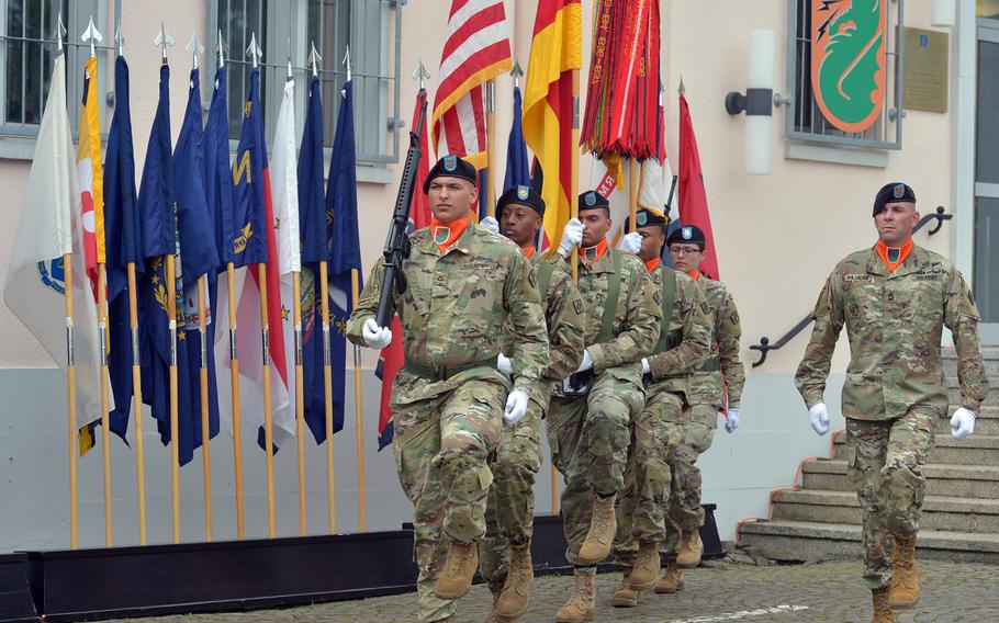 The color guard marches off the grounds at the conclusion of the 5th Signal Command's inactivation ceremony at Clay Kaserne in Wiesbaden, Germany, Friday, Aug. 4, 2017.