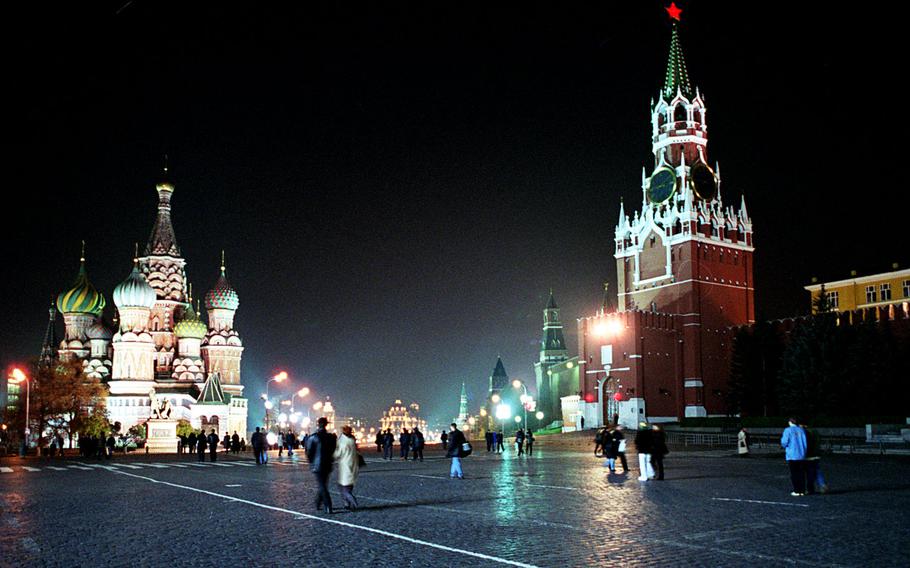 Tourists and residents stroll across Moscow's Red Square, with St. Basil's Cathedral on the left and the Kremlin with the Spassky tower at right. U.S. servicemembers and their families are experiencing increased levels of ''scrutiny and harassment'' while traveling to Russia, prompting an advisory to  avoid unofficial visits to the country.