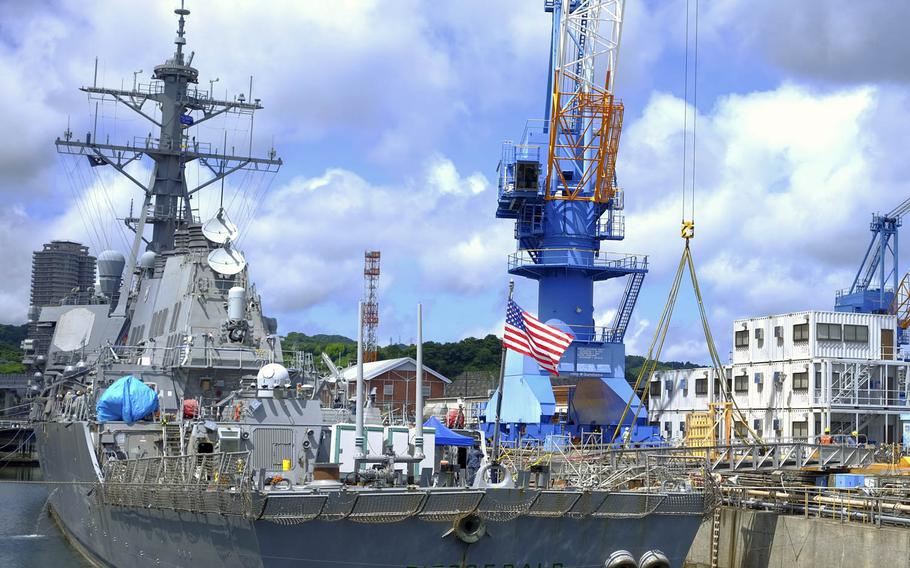 The collision-damaged USS Fitzgerald goes into dry dock at Yokosuka Naval Base, Japan, July 11, 2017.