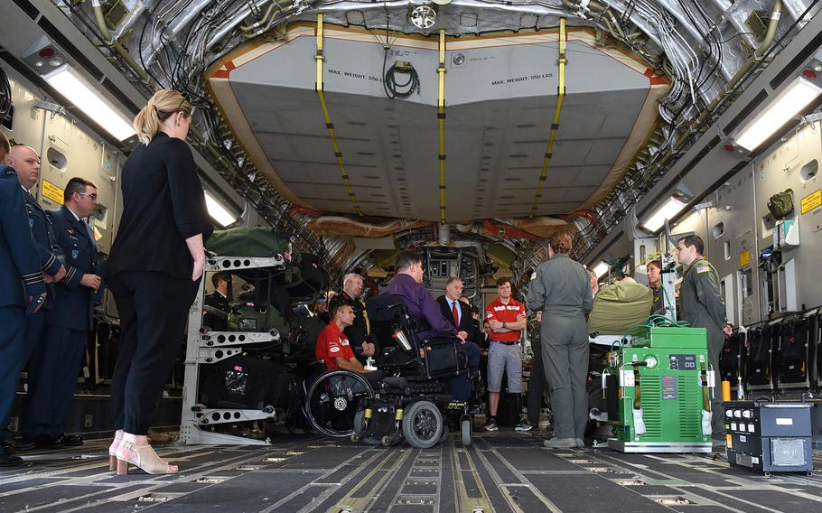 U.S. Air Force medical evacuation crew members describe their jobs from inside a C-17 at Ramstein Air Base, Germany, on Tuesday, August 15, 2017. Among those listening were two Canadians injured during combat in Afghanistan: Chris Klodt, a former Canadian Forces corporal who's now a paraplegic, and Maj. Simon Mailloux, who was able to return to duty with help of a prosthetic after losing his left leg in a roadside bomb.  Both plan to compete in the upcoming 2017 Invictus Games in Toronto.