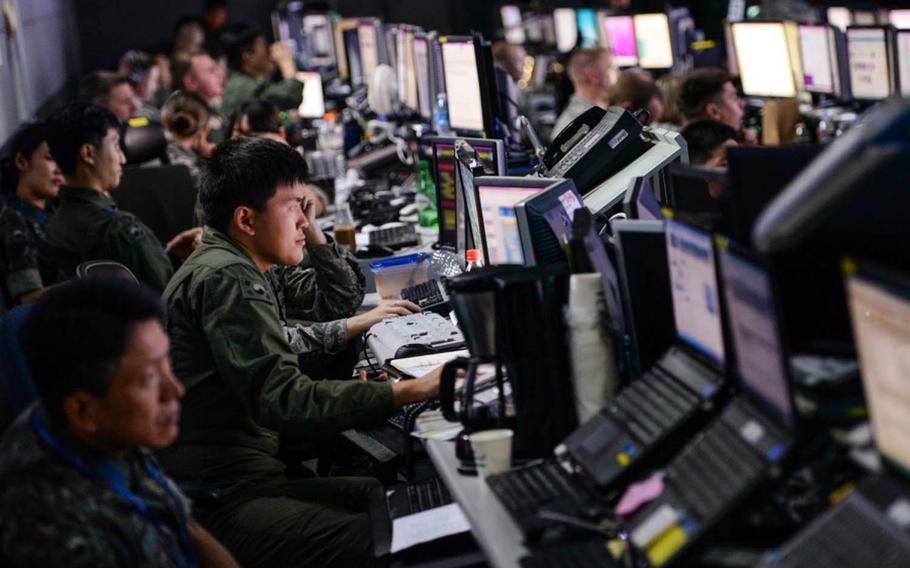 Members from the U.S. and South Korean militaries man the Hardened Theater Air Control Center at Osan Air Base, South Korea, during Ulchi Freedom Guardian drills in 2015. Portions of the image were blurred for security concerns.