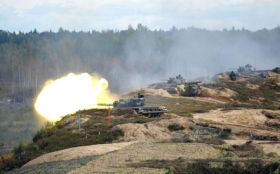 Tanks fire at the Gozhsky test ground during the Zapad Russian-Belarusian exercises in Belarus in Sept. 2013.