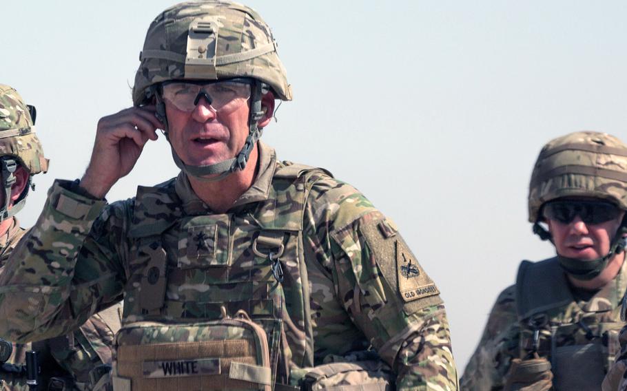 U.S. Army Maj. Gen. Robert White, commanding general of Combined Joint Forces Land Component Command-Operation Inherent Resolve, (left), arrives at the Besmaya Range Complex, Iraq, July 17, 2017.