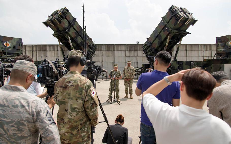 Adm. Harry Harris Jr., left, head of U.S. Pacific Command, speaks to reporters at Osan Air Base, South Korea, Tuesday, Aug. 22, 2017. Gen. Vincent Brooks, commander of U.S. Forces Korea, stands at his left.