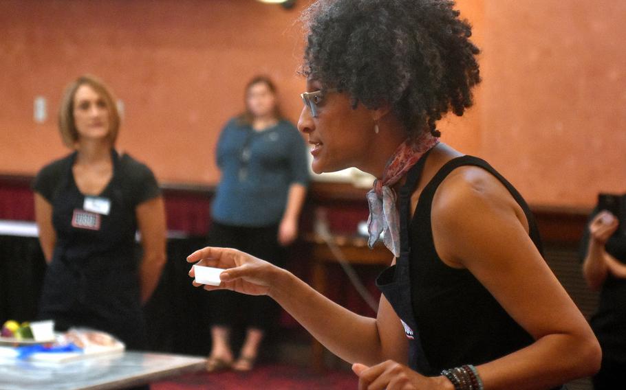 Celebrity chef Carla Hall talks about using the correct amount of salt during a cooking demonstration Wednesday, Aug. 23, 2017, at La Bella Vista Club at Aviano Air Base, Italy.