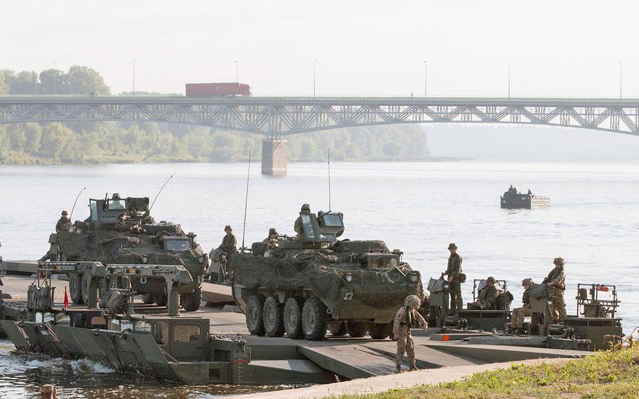 U.S. Army Strykers belonging to the 2nd Cavalry Regiment cross the Vistula River in Chelmno, Poland, on Wednesday, June 8, 2016. An Inspector General's report, released this week, cautioned that the resources for carrying out the military's European Reassurance Initiative could fall short of the demands of a campaign designed to reinforce NATO's eastern flank.
