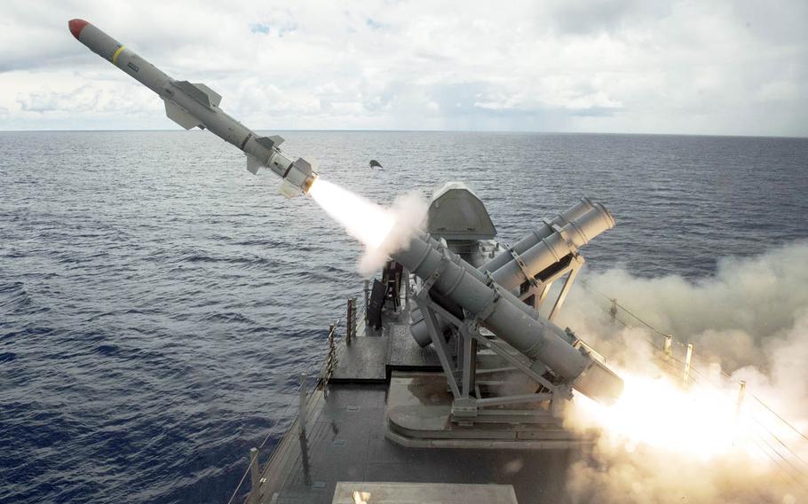A harpoon missile launches from the missile deck of the littoral combat ship USS Coronado off the coast of Guam, Tuesday, Aug. 22, 2017.