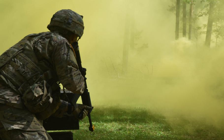 Sgt. Antonio Hernandez, a soldier with the 173rd Brigade Combat Team, advances through the smoke during the U.S. Army Europe Best Warrior Challenge, Aug. 22, 2017, at Grafenwoehr, Germany. 

Martin Egnash/Stars and Stripes
