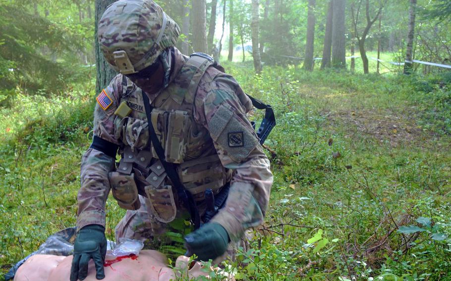 Lt. Jean Domguia, a soldier with the 2nd Theater Signal Brigade, conducts first aid procedures on a dummy during the U.S. Army Europe Best Warrior Challenge, Aug. 22, 2017, at Grafenwoehr, Germany. 

Martin Egnash/Stars and Stripes