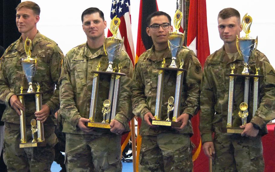 The winners of the U.S. Army Europe Best Warrior Challenge Lt. Christian Reeves, left, CW2 Kristopher Gillespie, Sgt. Jonathan Renteria, and Spc. Jacob Henriksen, right, stand after receiving their trophies, Aug. 25, 2017, at Grafenwoehr, Germany.  

Martin Egnash/Stars and Stripes