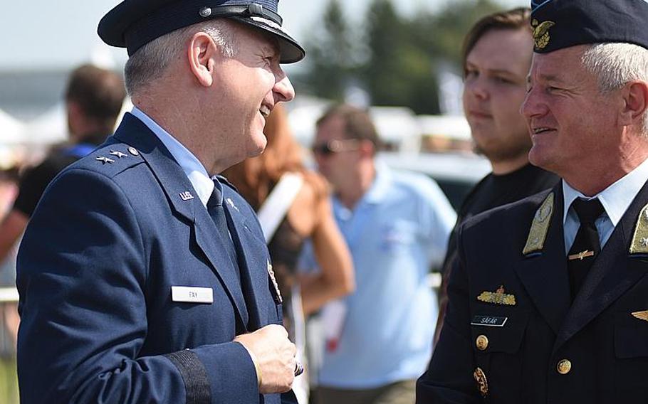Maj. Gen. Timothy Fay, U.S. Air Forces in Europe - Air Forces Africa deputy commander, shares a few words with Brig. Gen. Albert Safar, chief of Hungarian air forces, on Saturday, August 26, 2017, at the Slovak International Air Fest in Sliac, Slovakia.