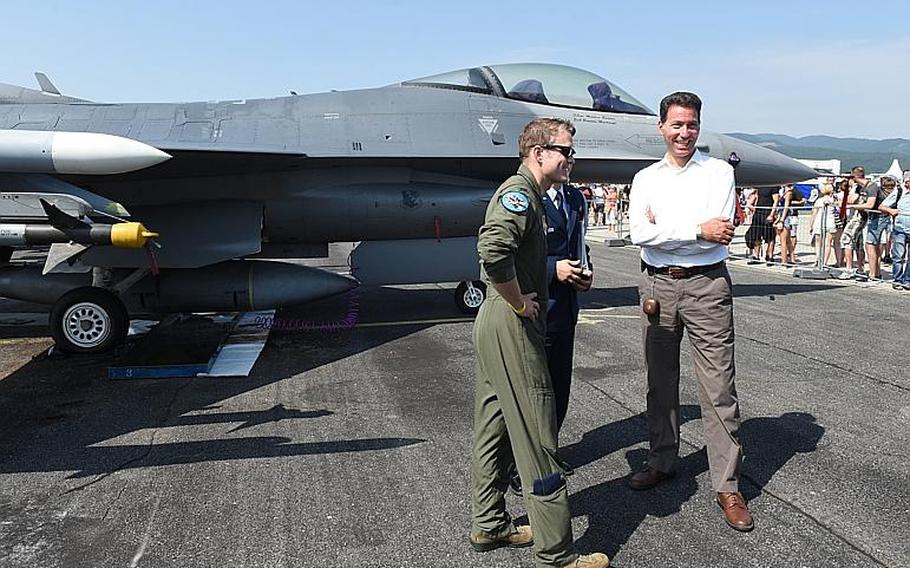 U.S. Ambassador to Slovakia Adam Sterling talks to U.S. Air Force Capt. Garen Payton Jappesen while standing next to an F-16 on Saturday, Aug. 26, 2017, at the Slovak International Air Fest in Sliac, Slovakia. Jappesen is an F-16 pilot with the 510th Fighter Squadron at Aviano Air Base, Italy.