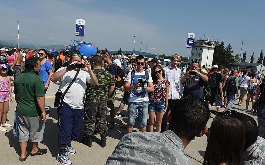 Airmen from Aviano Air Base, Italy, get their photos taken with and by air show visitors Saturday, Aug. 26, 2017, at the Slovak International Air Fest in Sliac, Slovakia.