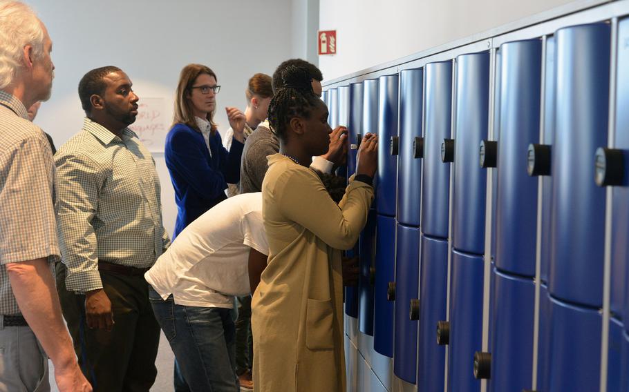 Wiesbaden High School staff help students set the combinations of their lockers on the first day of class at the new facility, the first 21st-century-designed school in the Department of Defense Education Activity.