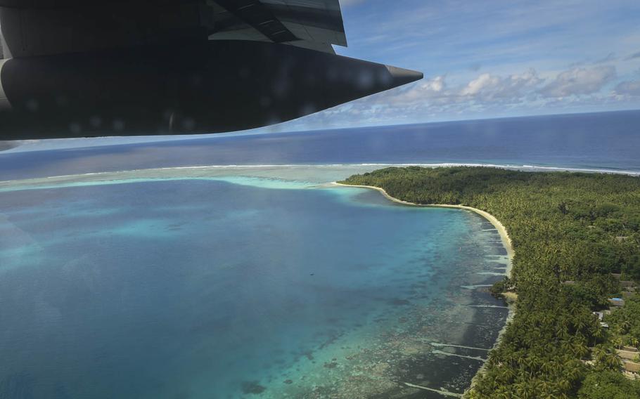 A C-130H Hercules from Yokota Air Base, Japan, flies over one of Palau's approximately 340 islands in the western Pacfiic Ocean, Dec. 11, 2016.