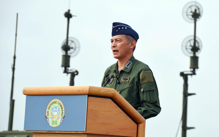 Lt. Gen. Hiroaki Maehara, chief of Japan's Air Defense Command, speaks to reporters in front of a Patriot missile-defense system at Yokota Air Base, Japan, Tuesday, Aug. 29, 2017.