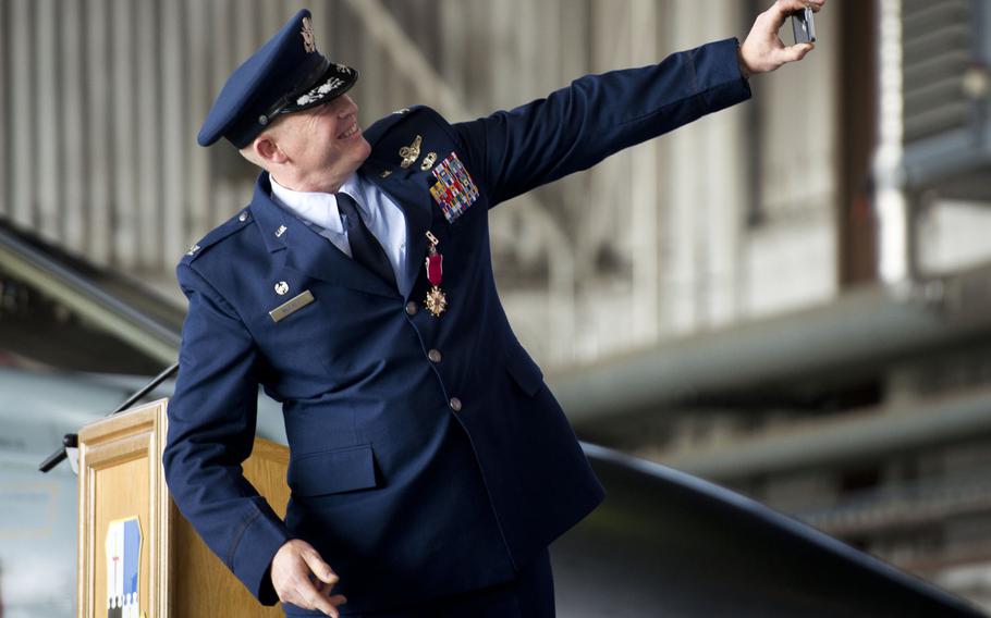 Col. Joseph McFall, outgoing 52nd Fighter Wing commander, takes a selfie during the wing's change-of-command ceremony at Spangdahlem Air Base, Germany on Tuesday, Aug. 29, 2017. McFall has been selected to be the 3rd Air Force vice commander at Ramstein Air Base, Germany.