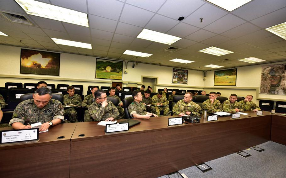 Third Republic of Korea Army commander Gen. Woon-Yong Kim meets with 2nd Infantry Division commander Maj. Gen. Scott McKean and other members of the combined U.S.-South Korean division to discuss lessons learned during annual joint war games known as Ulchi Freedom Guardian, at Camp Red Cloud, South Korea, Wednesday, Aug. 30, 2017.
