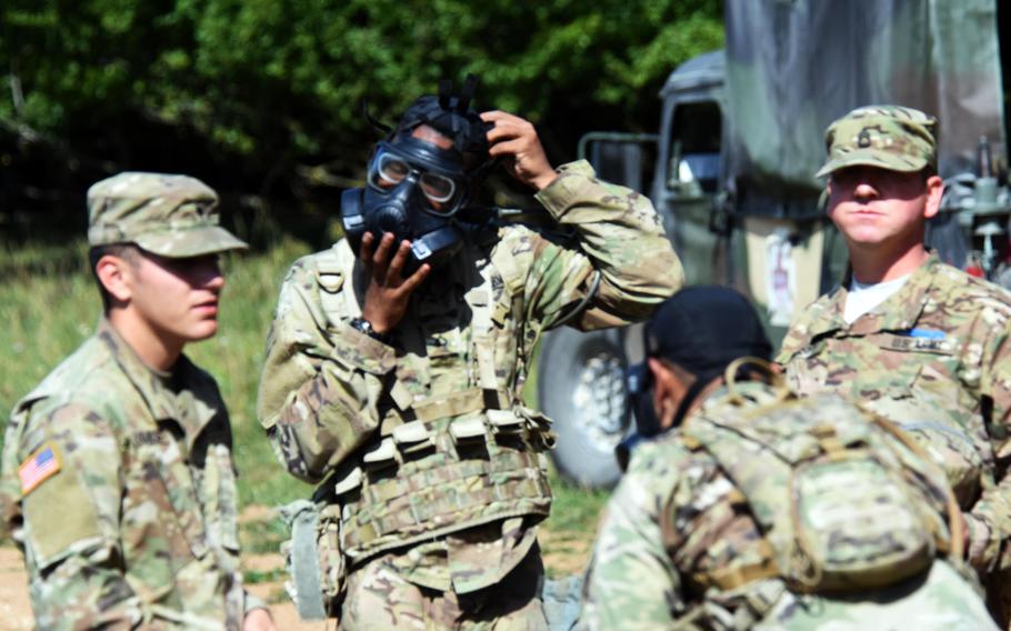 Soldiers practice quickly putting on their gas masks during Expert Infantry Badge certification at Hohenfels, Germany,  on Wednesday, Aug. 30, 2017.