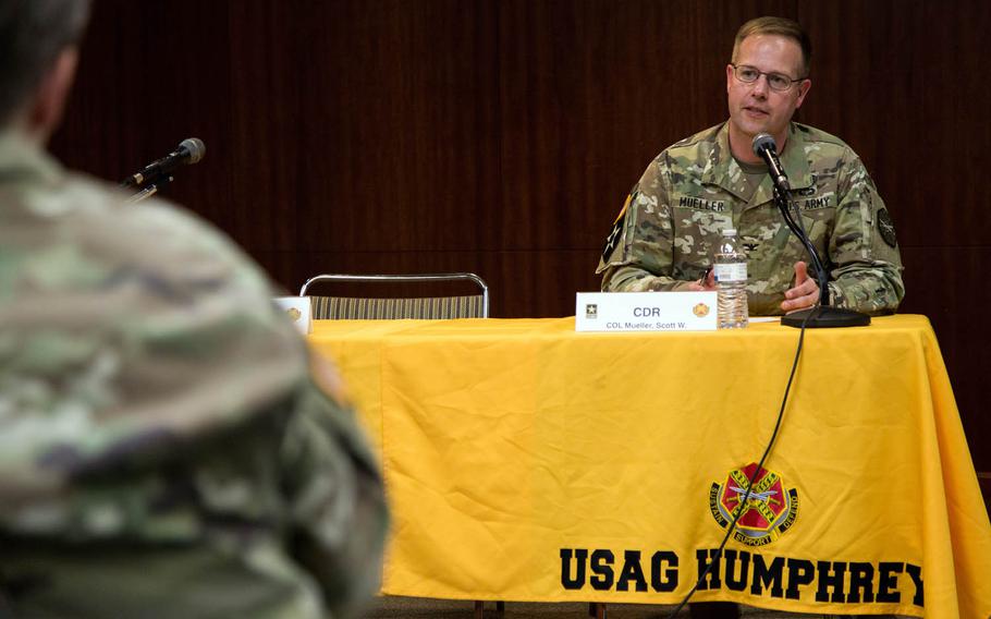 Col. Scott Mueller, Camp Humphreys garrison commander, answers questions during a town hall meeting at the base in South Korea, Thursday, Sept. 7, 2017.