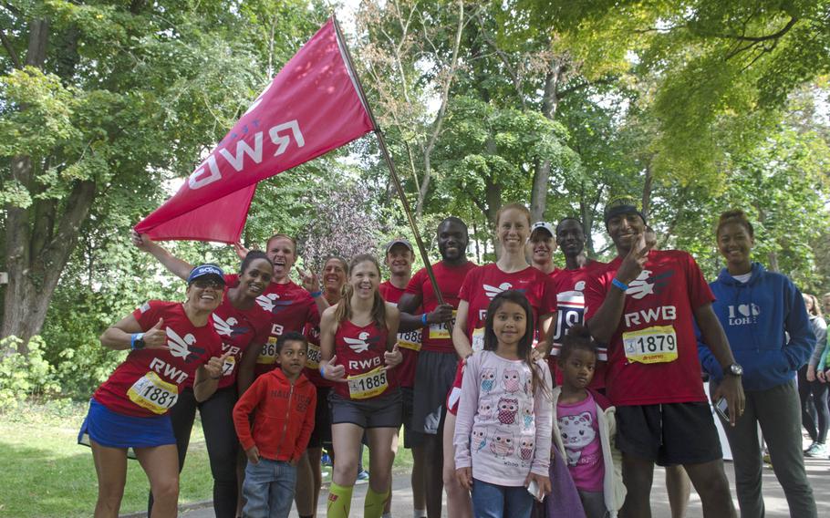 Soldiers and family members of U.S. Army Garrison celebrate at the Kurpark in downtown Wiesbaden after the conclusion of a 25-hour relay race, Sunday, Sept. 10, 2017. The 12-soldier team, the only all-American outfit, finished second of 11 teams in the race's competitve division.