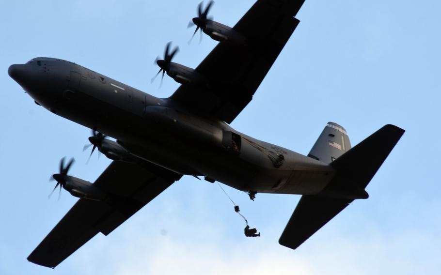 U.S. Army paratroopers jump out of a U.S. Air Force C-130 Hercules aircraft  to conduct