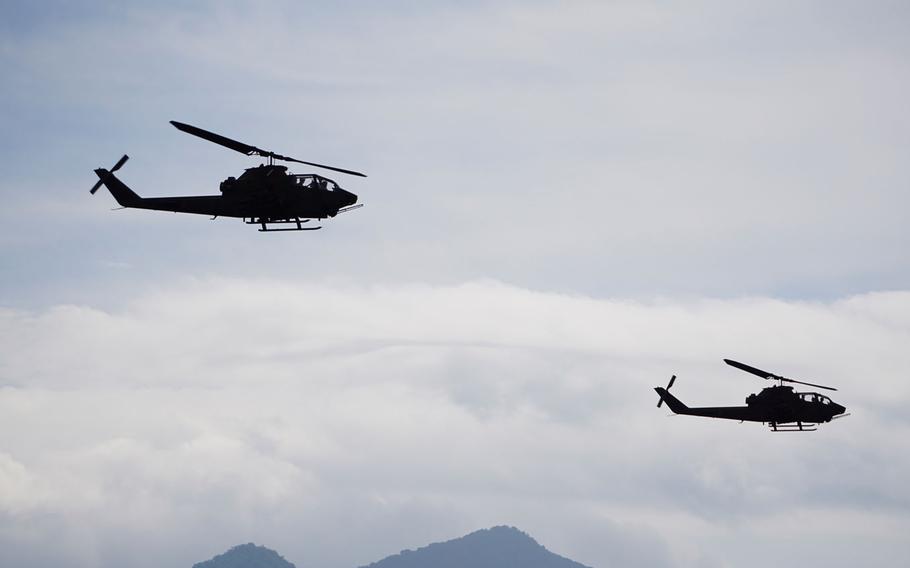 Japanese AH-1 Cobra attack helicopters with the 1st Division, Eastern Army provide overwatch during combined arms live-fire training during the Orient Shield exercise at East Fuji Maneuver Area, Japan, Tuesday, Sept. 19, 2017.