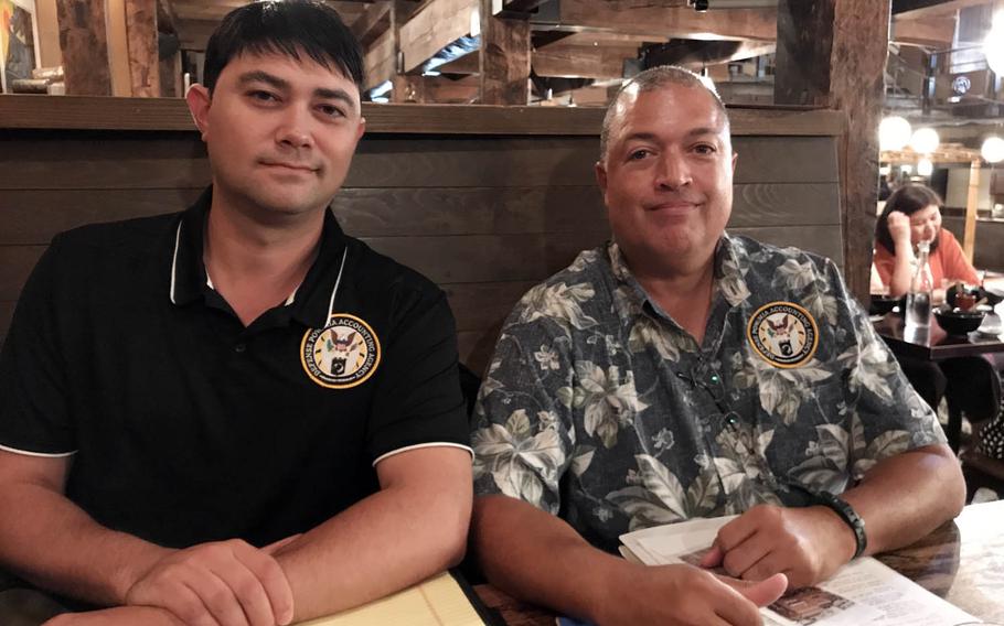 Air Force Capt. Joshua Caragan, left, and research analyst Terry Hunter from the Hawaii-based Defense POW/MIA Accounting Agency were in Tokyo on Sept. 15, 2017, looking for information about a World War II plane crash that killed 11 U.S. soldiers.