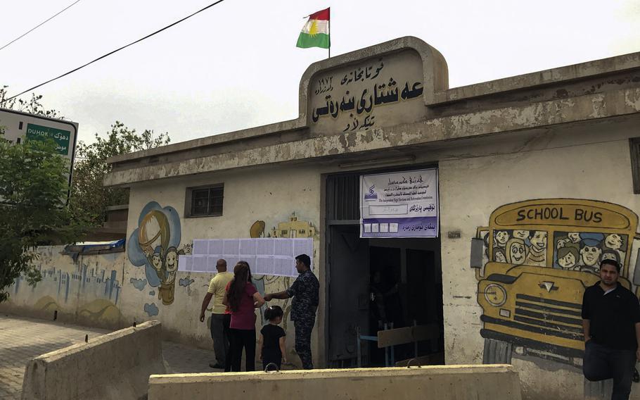 Voters outside a polling place for the Iraqi Kurdistan region's independence referendum are pictured here on Monday, Sept. 25, 2017, in a suburb of the region's capital of Irbil.