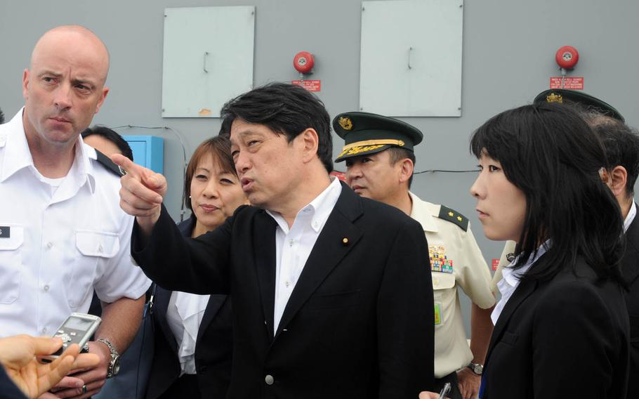 Minister of Defense Itsunori Onodera, center, said the Japanese government will move forward with a controversial U.S. military base relocation on Okinawa despite the discovery of an endangered species of coral at the site.