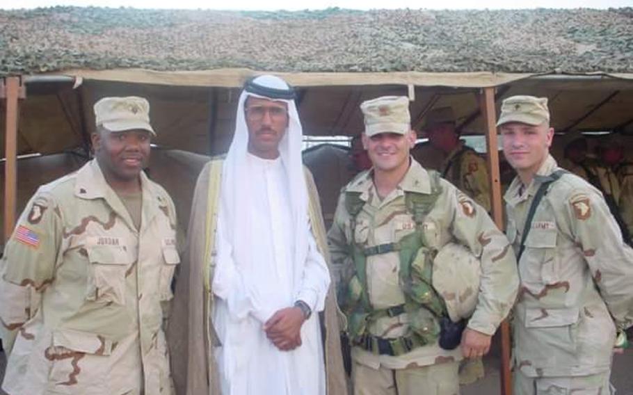 Pictured here during a 2003 visit to Qayara Airfield West, are, left to right, then-Spec. Anthony Jordan, Dr. Mohammed Ismail, then-Maj. Fred Wellman and then-Spec. Gabriel Morris. Ismail was a key partner in U.S. reconstruction around the airfield after the 2003 invasion of Iraq.