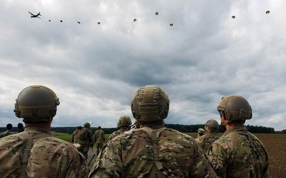 U.S. soldiers observe French Foreign Legion and British paratroopers land in a drop zone outside Hohenfels, Germany, during Exercise Swift Response, Oct. 9, 2017.